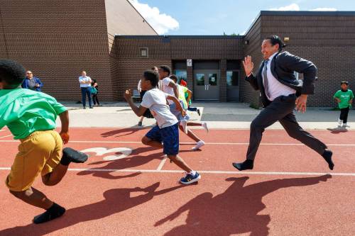 MIKE DEAL / FREE PRESS Premier Wab Kinew runs a race with the kids from the BGC (Boys and Girls Club) of Winnipeg after the announcement. Premier Wab Kinew and Education and Early Childhood Learning Minister Tracy Schmidt announces that the government is introducing a pilot program for a new health and physical education curriculum that includes an a policy making in-person physical education mandatory for all students from kindergarten to Grade 12. The press conference held on the playground of Victor Mager School, included other stake holders who spoke; Dr. Brent Roussin, chief provincial public health officer, Jason Cline, superintendent, Rolling River School Division, Alyson Gysel, co-president, Physical Health Educators of Manitoba, and Noelle Depape, president and CEO, Boys and Girls Club Winnipeg. Reporter: Maggie Macintosh 260827 - Thursday, August 27, 2026.