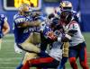 John Woods / THE CANADIAN PRESS
                                Winnipeg Blue Bombers&rsquo; Brady Oliveira rumbles for a first down as he&rsquo;s tackled by Montreal Alouettes&rsquo; Kabion Ento in the first half of the Bombers 44-28 win on Friday at Princess Auto Stadium.
