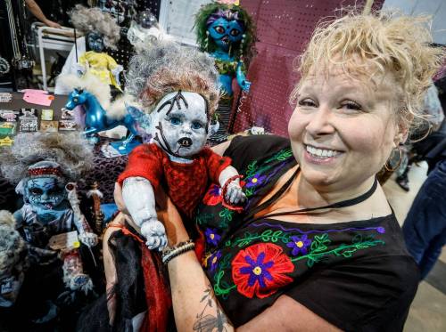 JOHN WOODS / FREE PRESS
                                Katherine Blahut, artist and owner of Katod, paints old dolls in a creative way and sells them at shows like the Oddly Curious Market at the Franco-Manitoban Cultural Centre Sunday, August 30, 2026. reporter: chris