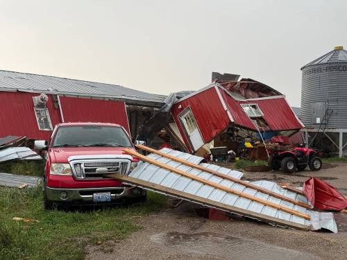 KELVIN SIEMENS PHOTO
                                A tornado damaged several buildings on a farm near the community of Kola, which is just south of Elkhorn.