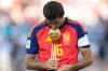 Spain's Rodri poses with the tournament's best player award at the end of the World Cup final soccer match between Spain and Argentina in East Rutherford, N.J., near New York, Sunday, July 19, 2026. (AP Photo/Ashley Landis)