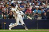 Milwaukee Brewers' Joey Ortiz hits an RBI single during the fifth inning of a baseball game against the Pittsburgh Pirates, Monday, Aug. 3, 2026, in Milwaukee. (AP Photo/Aaron Gash)