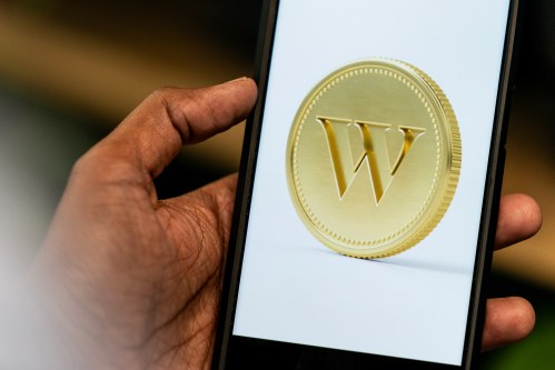 An app screenshot for Wealthsimple is seen on a smartphone in a photo illustration made in Toronto, Monday, June 17, 2024. THE CANADIAN PRESS/Giordano Ciampini