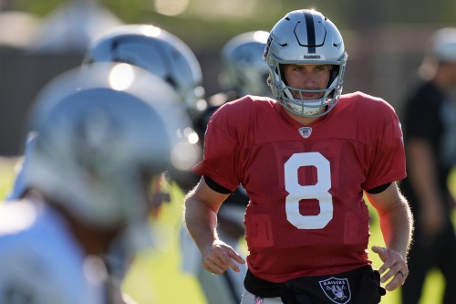 Las Vegas Raiders quarterback Kirk Cousins (8) warms up during practice at the team's NFL football training camp Tuesday, Aug. 4, 2026, in Henderson, Nev. (AP Photo/John Locher)
