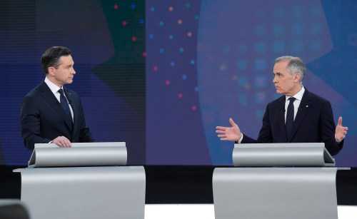 Conservative Leader Pierre Poilievre, left, and Liberal Leader Mark Carney participate in the English-language federal leaders' debate in Montreal, Thursday, April 17, 2025. THE CANADIAN PRESS/Christopher Katsarov