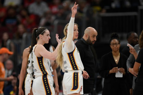 Indiana Fever's Sophie Cunningham, right, and teammate Caitlin Clark, left, wave goodbye to Chicago Sky's DiJonai Carrington after Carrington was ejected from the game for committing a flagrant foul against Cunningham during the first half of an WNBA basketball game in Chicago, Saturday, Aug. 8, 2026. (AP Photo/Paul Beaty)