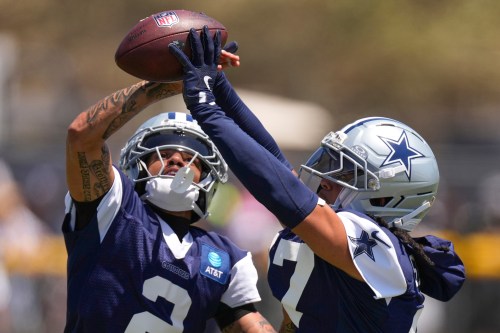Dallas Cowboys cornerback Cobie Durant, left, and defensive back Reddy Steward vie for the ball during the NFL football team's training camp, Saturday, Aug. 1, 2026, in Oxnard, Calif. (AP Photo/Mark J. Terrill)