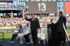 Former Chicago White Sox player and manager Ozzie Guillen gestures as his number was retired before a baseball game between the Chicago White Sox and the Cleveland Guardians, Saturday, Aug. 8, 2026, in Chicago. (AP Photo/David Banks)