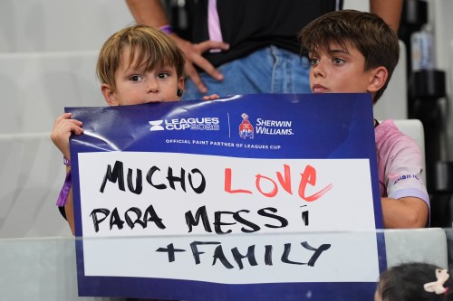 Fans hold a sign in support of Inter Miami forward Lionel Messi, who's father Jorge Messi passed away, before a Leagues Cup soccer match between Inter Miami and Monterrey, Saturday, Aug. 8, 2026, in Miami. (AP Photo/Lynne Sladky)