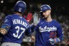 Los Angeles Dodgers' Kyle Tucker celebrates with Teoscar Hernández (37) after hitting a solo home run against the Arizona Diamondbacks in the eighth inning of a baseball game, Saturday, Aug. 8, 2026, in Phoenix. (AP Photo/Rick Scuteri)