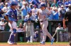 Chicago Cubs' Ian Happ crosses the plate after hitting a two-run home run during the sixth inning of a baseball game against the Kansas City Royals, Sunday, Aug. 9, 2026, in Kansas City, Mo. (AP Photo/Charlie Riedel)