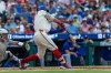 Philadelphia Phillies designated hitter Kyle Schwarber hits a three-run home run during the third inning of a baseball game against the Toronto Blue Jays, Sunday, Aug. 9, 2026, in Philadelphia. (AP Photo/Laurence Kesterson)