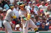 Athletics' Jacob Wilson takes a strike swinging during the fifth inning of a baseball game against the Boston Red Sox, Sunday, Aug. 9, 2026, in Boston. (AP Photo/Mark Stockwell)