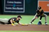 San Diego Padres third baseman Gage Workman, left, misses a grounder but Padres shortstop Sung-Mun Song, right, of South Korea, fields the grounder hit by Arizona Diamondbacks' Tyler Locklear during the seventh inning of a baseball game, Wednesday, Aug. 5, 2026, in Phoenix. (AP Photo/Ross D. Franklin)