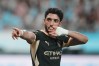 Manchester City's Omar Marmoush celebrates after scoring his side's opening goal during the preseason friendly soccer match between Manchester City and Atletico Madrid in Seoul, South Korea, Sunday, Aug. 9, 2026. (AP Photo/Lee Jin-man)
