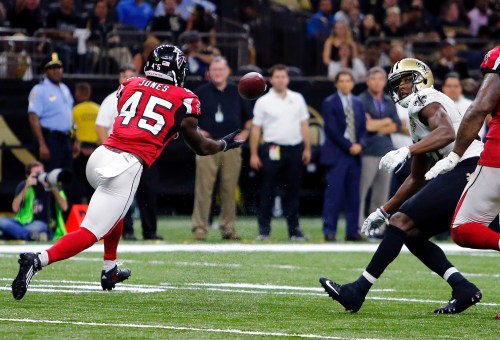 FILE - Atlanta Falcons outside linebacker Deion Jones (45) intercepts a pass from New Orleans Saints quarterback Drew Brees, not pictured, and returns it for a touchdown, in the second half of an NFL football game in New Orleans, on Sept. 26, 2016. (AP Photo/Butch Dill, File)