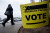 People enter an Elections Canada voting location, in Terrebonne, Que., on Monday, April 13, 2026. THE CANADIAN PRESS/Christopher Katsarov