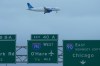 A United airplane descends to land at O'Hare International Airport in Chicago, Sunday, Nov. 30, 2025. (AP Photo/Nam Y. Huh)