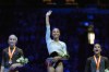All Around second place finisher Claire Pease, left, All Around Champion Hezly Rivera, center, and All Around third place finisher Charleigh Bullock, right, stand on the podium at the U.S. Gymnastics Championships, Sunday, Aug. 9, 2026, in Phoenix. (AP Photo/Ross D. Franklin)