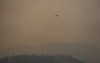 A helicopter being used to battle the Bald Range wildfire takes off from the Penticton Regional Airport, in Penticton, B.C., on Monday, Aug. 10, 2026. THE CANADIAN PRESS/Darryl Dyck