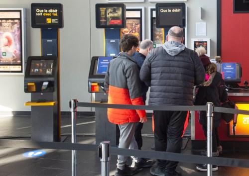 People buy tickets at a Cineplex movie theatre in Laval, Que., on Friday, Feb. 26, 2021. THE CANADIAN PRESS/Ryan Remiorz