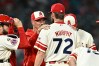 Los Angeles Angels pitcher Luke Murphy (72) speaks with pitching coach Mike Maddux, second from left, during the eighth inning of a baseball game against the Milwaukee Brewers, Friday, July 31, 2026, in Anaheim, Calif. (AP Photo/William Liang)