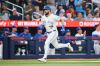 Toronto Blue Jays' Nathan Lukes (38) comes in to score on an RBI double by Brett Bateman (21) during third inning Major League Baseball action against the Boston Red Sox in Toronto, on Tuesday, Aug. 11, 2026. THE CANADIAN PRESS/Sammy Kogan