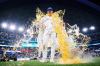 Toronto Blue Jays' Brett Bateman (21) is doused with a sports drink after the Toronto Blue Jays' win against the Boston Red Sox in Major League Baseball action in Toronto, on Tuesday, Aug. 11, 2026. THE CANADIAN PRESS/Sammy Kogan