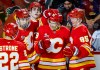 Calgary Flames' Zayne Parekh (19) celebrates his goal with teammates during third period NHL hockey action against the Los Angeles Kings in Calgary on Thursday, April 16, 2026.THE CANADIAN PRESS/Jeff McIntosh