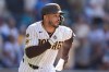 San Diego Padres' Luis Campusano, runs after hitting a walk off single to defeat the Brewers during the eleventh inning of a baseball game Wednesday, Aug. 12, 2026, in San Diego. (AP Photo/Gregory Bull)