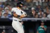 New York Yankees' Trent Grisham follows through on a home run during the fifth inning of a baseball game against the Seattle Mariners Wednesday, Aug. 12, 2026, in New York. (AP Photo/Frank Franklin II)
