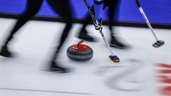 A curling stone slides down the ice sheet at the Scotties Tournament of Hearts in Calgary on Feb. 21, 2024. THE CANADIAN PRESS/Jeff McIntosh