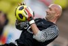 FILE - French goalkeeper Fabien Barthez warms up before a charity match between Olympique Marseille soccer team and a team of Manchester United with Sir Alex Ferguson, Tuesday, Aug. 2, 2011, in Monaco stadium. (AP Photo/Lionel Cironneau, File)