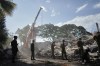Soldiers clear debris three days after an earthquake struck Cali, Colombia, Thursday, Aug. 13, 2026. (AP Photo/Ivan Valencia)