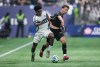 Vancouver Whitecaps' Ralph Priso, front left, and Los Angeles FC's Nathan Ordaz vie for the ball during the first half of the MLS Western Conference semifinal playoff soccer match, in Vancouver, on Saturday, November 22, 2025. THE CANADIAN PRESS/Darryl Dyck