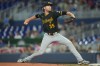 Pittsburgh Pirates starting pitcher Braxton Ashcraft (35) aims a pitch during the first inning of a baseball game against the Miami Marlins Thursday, Aug. 13, 2026, in Miami. (AP Photo/Marta Lavandier)