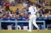 Los Angeles Dodgers pitcher Edwin Díaz walks off the field after being taken out of the game during the ninth inning of a baseball game against the Milwaukee Brewers, Thursday, Aug. 13, 2026, in Los Angeles. (AP Photo/Mark J. Terrill)