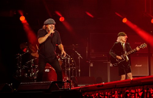 Singer Brian Johnson and lead guitarist Angus Young of legendary rockband AC/DC perform on stage at the sold-out Veltins-Arena in Gelsenkirchen, Germany, at the start of their Europe Power Up tour on Friday, May 17, 2024. (AP Photo/Martin Meissner)
