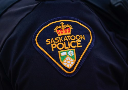 A Saskatoon Police Service badge is shown on an officers' uniform in Saskatoon on Friday, May 5, 2023. Police in Saskatoon say a man has been arrested after a deadly crash in the city Saturday morning. THE CANADIAN PRESS/Heywood Yu
