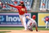 Cincinnati Reds' Matt McLain (9) is out at second base as Washington Nationals shortstop CJ Abrams, top, throws to first base to put out Reds' TJ Friedl for a double play during the eighth inning of a baseball game, Sunday, Aug. 9, 2026, in Washington. (AP Photo/Nick Wass)