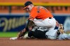 Chicago White Sox's Chase Meidroth (10) slides safely into second base ahead of the tag of Detroit Tigers shortstop Kevin McGonigle (7) during the ninth inning of a baseball game Friday, Aug. 14, 2026, in Detroit. (AP Photo/Paul Sancya)