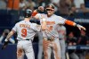 Baltimore Orioles' Gunnar Henderson (2) celebrates his two-run home run off Tampa Bay Rays pitcher Chris Roycroft with Tyler O'Neill (9) during the eighth inning of a baseball game Friday, Aug. 14, 2026, in St. Petersburg, Fla. (AP Photo/Chris O'Meara)