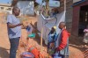 Gédéon Banga Ngbape, left, an Ebola surveillance officer, does contact tracing in Nizi, Ituri province, eastern Congo, Friday, Aug. 14, 2026. (AP Photo/Dieudonne Dirole)