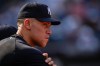 New York Yankees' Aaron Judge watches from the dugout during the ninth inning of a baseball game against the Seattle Mariners, Thursday, Aug. 13, 2026, in New York. (AP Photo/Yuki Iwamura)