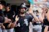 Chicago White Sox's Randal Grichuk (34) celebrates scoring against the Detroit Tigers during the seventh inning of a baseball game Saturday, Aug. 15, 2026, in Detroit. (AP Photo/Paul Sancya)