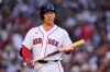 Boston Red Sox's Masataka Yoshida heads back to the dugout after striking out during the second inning of a baseball game against the Chicago White Sox, Thursday, Aug. 6, 2026, in Boston. (AP Photo/Charles Krupa)