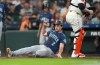 Seattle Mariners' Cole Young scores a run on Brendan Donovan's RBI single during the fourth inning of a baseball game against Houston Astros, Saturday, Aug. 15, 2026, in Houston. (AP Photo/Karen Warren)