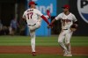 Cleveland Guardians' Angel Genao (17) greets Steven Kwan, right, at the end of a baseball game against the San Diego Padres, Saturday, Aug. 15, 2026, in Cleveland. (AP Photo/Phil Long)