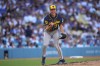 Milwaukee Brewers starting pitcher Jacob Misiorowski, left, celebrates after striking out Los Angeles Dodgers' Tommy Edman during the sixth inning of a baseball game Saturday, Aug. 15, 2026, in Los Angeles. (AP Photo/Mark J. Terrill)