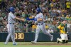 Texas Rangers' Wyatt Langford, right, high-fives Corey Seager after hitting a two-run home run during the sixth inning of a baseball game against the Athletics Saturday, Aug. 15, 2026, in West Sacramento, Calif. (AP Photo/Sara Nevis)